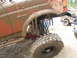 1989 Ford Bronco - A heavily mud-covered 1989 Ford Bronco shows off its lifted suspension and large off-road tires during an off-road event.