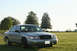 2004 Ford Crown Victoria - A silver 2004 Ford Crown Victoria is parked outside on a sunny day.