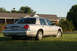 2004 Ford Crown Victoria - This 2004 Ford Crown Victoria is seen from the rear, parked on a grassy lawn in front of a house.
