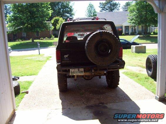 Rear view of black 1989 Ford Bronco II with spare tire on door