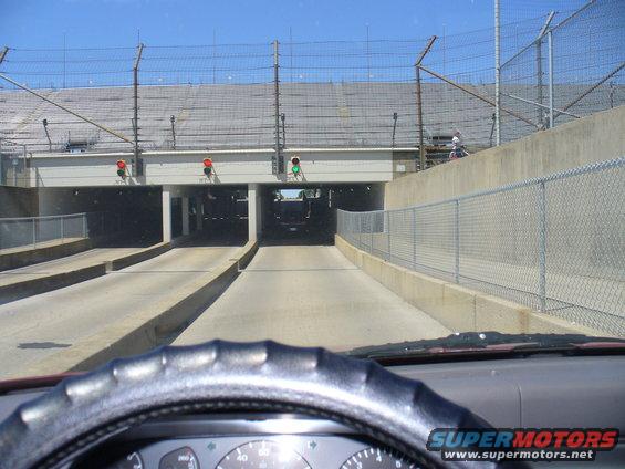 Interior view of a car driving through a tunnel at a racetrack