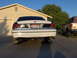 1999 Ford Crown Victoria - Rear view of a 1999 Ford Crown Victoria, parked next to an SUV in a driveway.