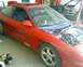 1993 Ford Probe - This 1993 Ford Probe GT is in a garage with its hood up, revealing the engine compartment.