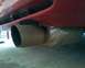 1993 Ford Probe - Close-up of a vehicle's exhaust pipe and lower rear bodywork.