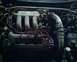 1993 Ford Probe - The engine bay of a 1993 Ford Probe, showing the V6 engine and various components.