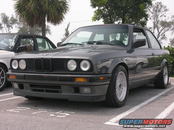 1989 BMW 3 Series coupe parked in a lot, front 3/4 view