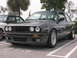 1989 BMW 3 Series - A dark gray 1989 BMW 3 Series coupe is parked next to another car.
