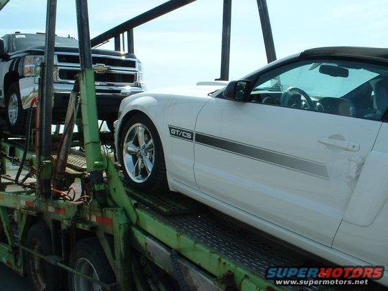 White 2007 Ford Mustang GT/CS convertible side view on car carrier