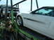 2007 Ford Mustang - A white 2007 Ford Mustang GT/CS convertible is seen on a car carrier, with a black Chevrolet truck behind it.