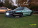 1901 Honda Odyssey - A modified Ford Probe is parked on grass with another car in the background. The date 11/02/2005 is visible.