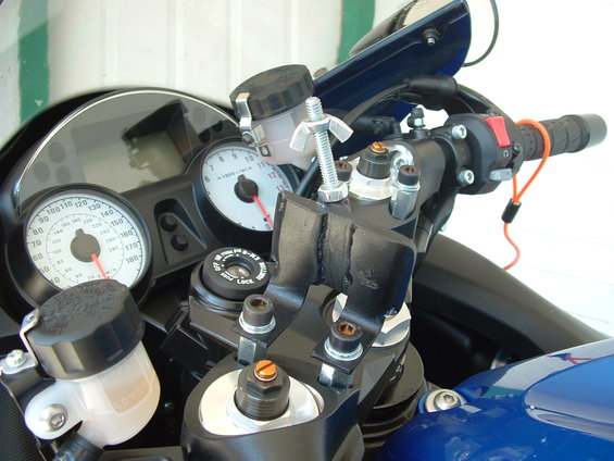2007 Kawasaki Ninja handlebars with gauges, brake fluid reservoir, and ignition switch