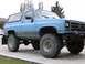 1989 Chevrolet Blazer - This lifted SUV has a two-tone blue and gray paint scheme and aggressive off-road tires.
