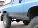 1989 Chevrolet Blazer - This lifted pickup truck features a two-tone paint scheme and aggressive off-road tires.