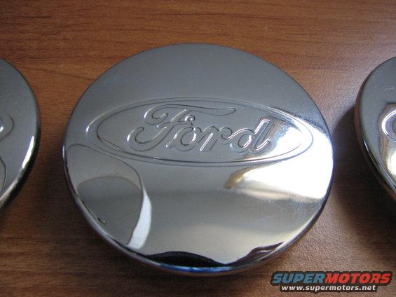 Chrome Ford hubcap with embossed logo