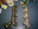 2003 Mercury Marauder - Two cast iron exhaust manifolds are displayed on a blue surface, with one showing a Ford logo.