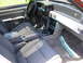 1967 Ford Mustang - The interior of a 1993 Ford Mustang features grey cloth seats and a manual transmission shifter.