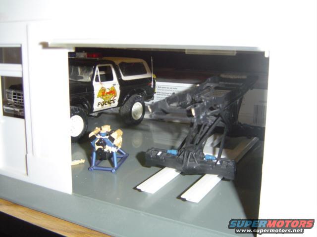 Black and white police Bronco model, 3/4 front view