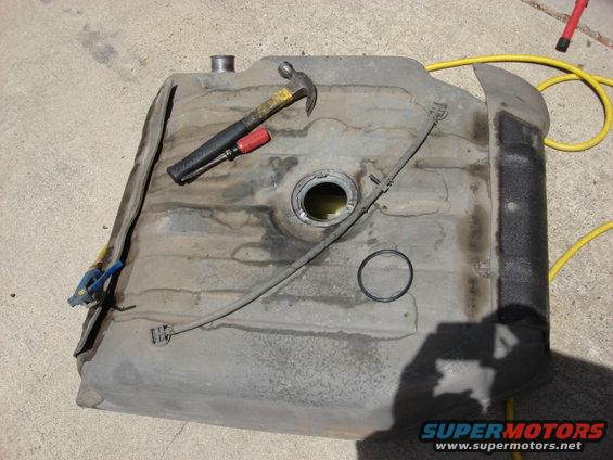 gas-tank.jpg well i had to swap out the fuel tank pump. you have to disconnect the fuel fill tube and the skid plate and the cover and drop the tank. here is the tank out of the beast.