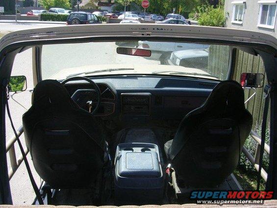 Interior of a beige SUV, showing front seats, dashboard, and center console