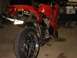 2002 Honda Interceptor - Rear view of a red sport motorcycle with dual exhaust pipes and a license plate.