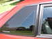 1967 Ford Mustang - Side view of a red car, a "Mustang" badge on the window trim.