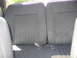 1967 Ford Mustang - Interior view of a gray fabric rear seat with visible seatbelt buckles.