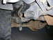 1988 Ford Bronco - Close-up view of the rear leaf spring suspension and axle assembly of a truck.