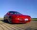 1993 Ford Probe - This red 1993 Ford Probe GT is shown from a low angle with the front three-quarter view.