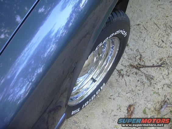 Blue vehicle wheel with chrome rim and BFGoodrich Radial T/A tire