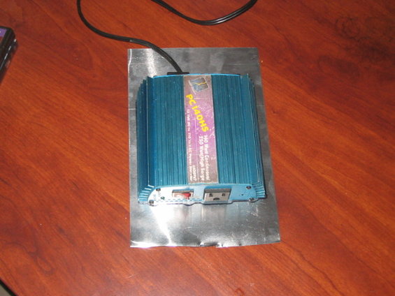 blue power inverter with ports and switch on metal plate