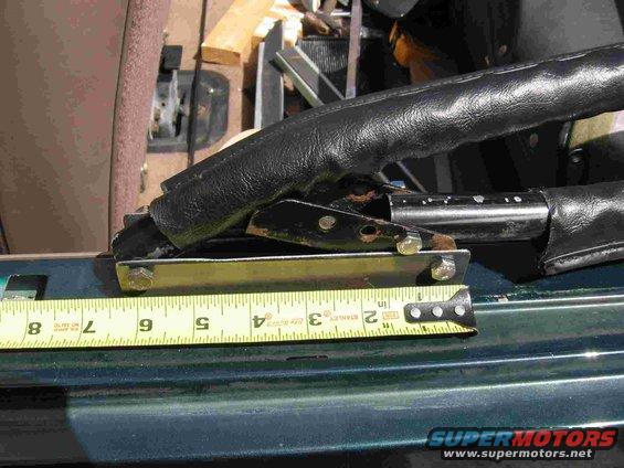 bow-mount.jpg I bought some 1.5" square steel and cut one side out with a sawzall to build the Bow mounts. A lot of time was spent with a grinder to clean up the inside edges so that the bows would move freely. The mount is about 3/4" longer than the original but works fine. Its attached to the bedside with sheetmetal screws.