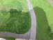 1995 Ford Bronco - The shadow of a building falls across a grassy landscape with a winding stone path.