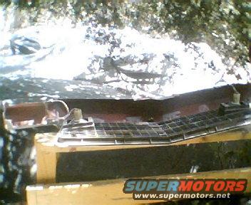1973 Ford Ranchero grille on wooden supports outdoors