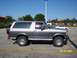 1996 Ford Bronco - This two-tone gray and silver SUV is a 1996 Ford Bronco, viewed from the side.