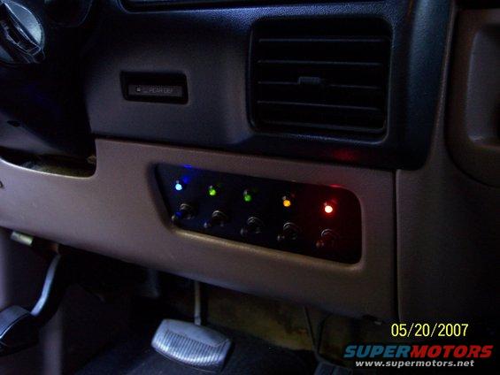 switch-panel-10.jpg Everything switched on:

Blue (flashing) - Strobes/wig-wags (just for fun)
Green - Empty
Green - Driving lights
Amber - Fog lights
Red - Reverse lights
