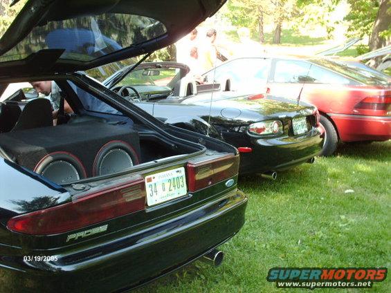 Black Ford Probe with trunk open showing subwoofers, license plate 34 2403