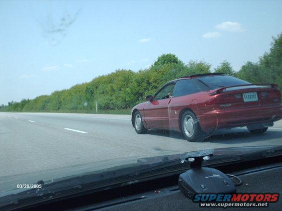 Red 1995 Ford Probe 3q-front view on highway