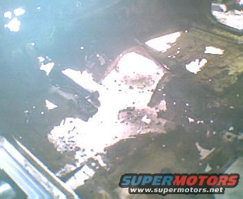 rusted floor pan with debris