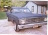 Dark blue 1966 Ford Ranchero parked in driveway