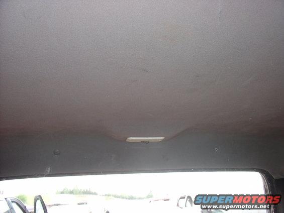 Gray interior headliner with a light fixture
