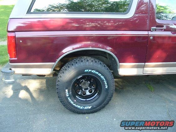 Rear side of maroon SUV with BFGoodrich All-Terrain tires