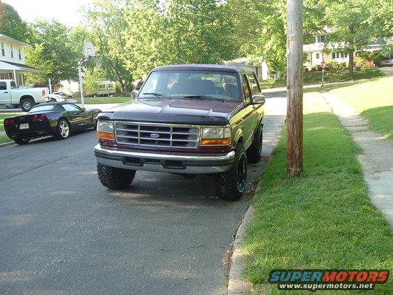 Maroon 1996 Ford Bronco front view parked on street
