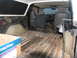 1978 Ford Bronco - The interior of a 1978 Ford Bronco shows signs of wear and tear, with a bare metal floor and basic seating.