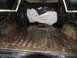 1978 Ford Bronco - The interior of a truck bed is shown, with a white tarp obscuring an object within.