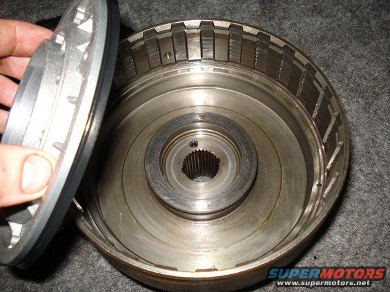 Transmission drum with splined input shaft and a clutch pack being held