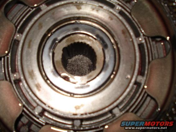 Close-up of a transmission torque converter's internal splined hub and stator assembly