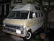 1971 Ford E350 - This Ford Econoline van, likely from the late 1960s, is parked in a driveway next to a tree.
