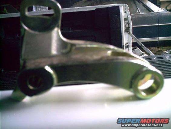 Close-up of a metal bracket part, possibly for a vehicle