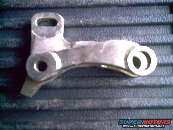 metal linkage part with two holes and a curved arm