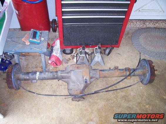 rear axle assembly with brake drums and cables